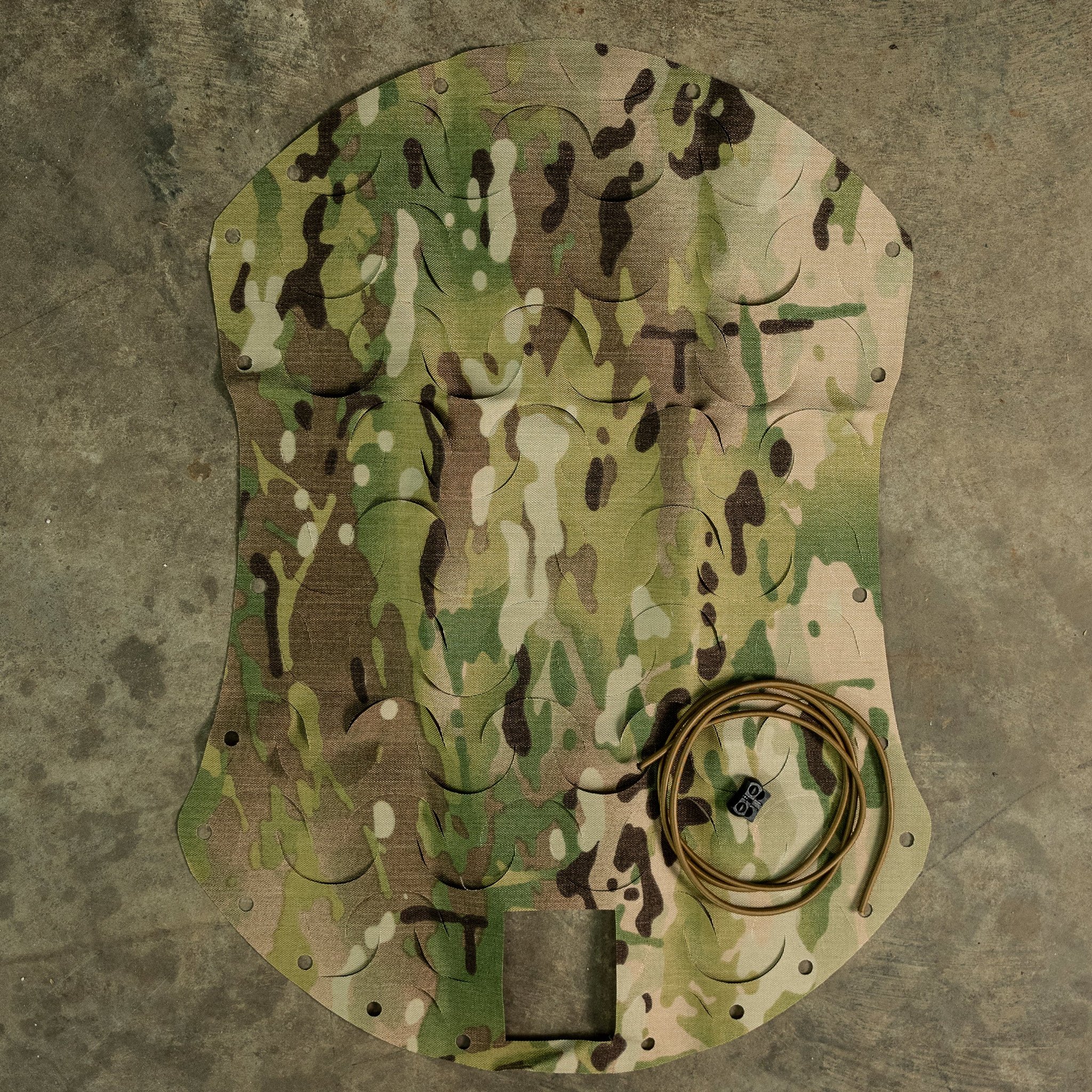 HelmetScrim attaches to your high-cut helmet, breaking up its silhouette and improving its camouflage in both the visible and IR spectrums. It attaches via a simple shock cord, stretching over your helmet, and has a rectangular cut out for your NVG mount. It is made in the US using licensed camouflage patterns and durable, NIR compliant materials.

