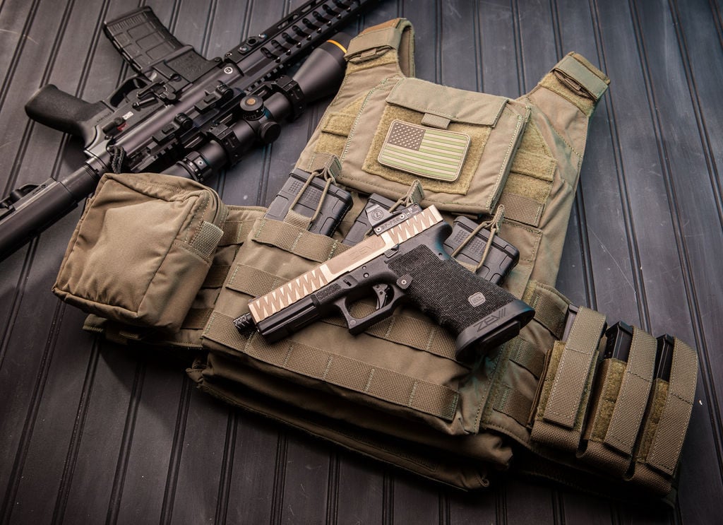 TAG’s® Vanguard plate carrier sets the standard in the industry for what a plate should be. The Vanguard is a light weight plate carrier that works with any set of hard armor plates and soft armor backers. SAPI, ESAPI, XSAPI, standalone level 4, swimmer cut and shooter cut armor plates all fit into the Vanguard. The triple magazine front panel is sewn into the carrier and will fit 30 round 5.56mm, AK47, and 7.62 x 51 magazines. You will never need to change out your magazine pouches again when using different weapon platforms.

