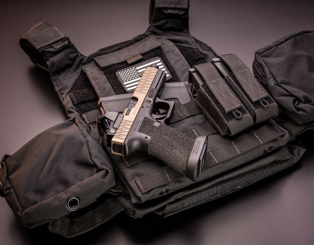 TAG’s® Vanguard plate carrier sets the standard in the industry for what a plate should be. The Vanguard is a light weight plate carrier that works with any set of hard armor plates and soft armor backers. SAPI, ESAPI, XSAPI, standalone level 4, swimmer cut and shooter cut armor plates all fit into the Vanguard. The triple magazine front panel is sewn into the carrier and will fit 30 round 5.56mm, AK47, and 7.62 x 51 magazines. You will never need to change out your magazine pouches again when using different weapon platforms.

