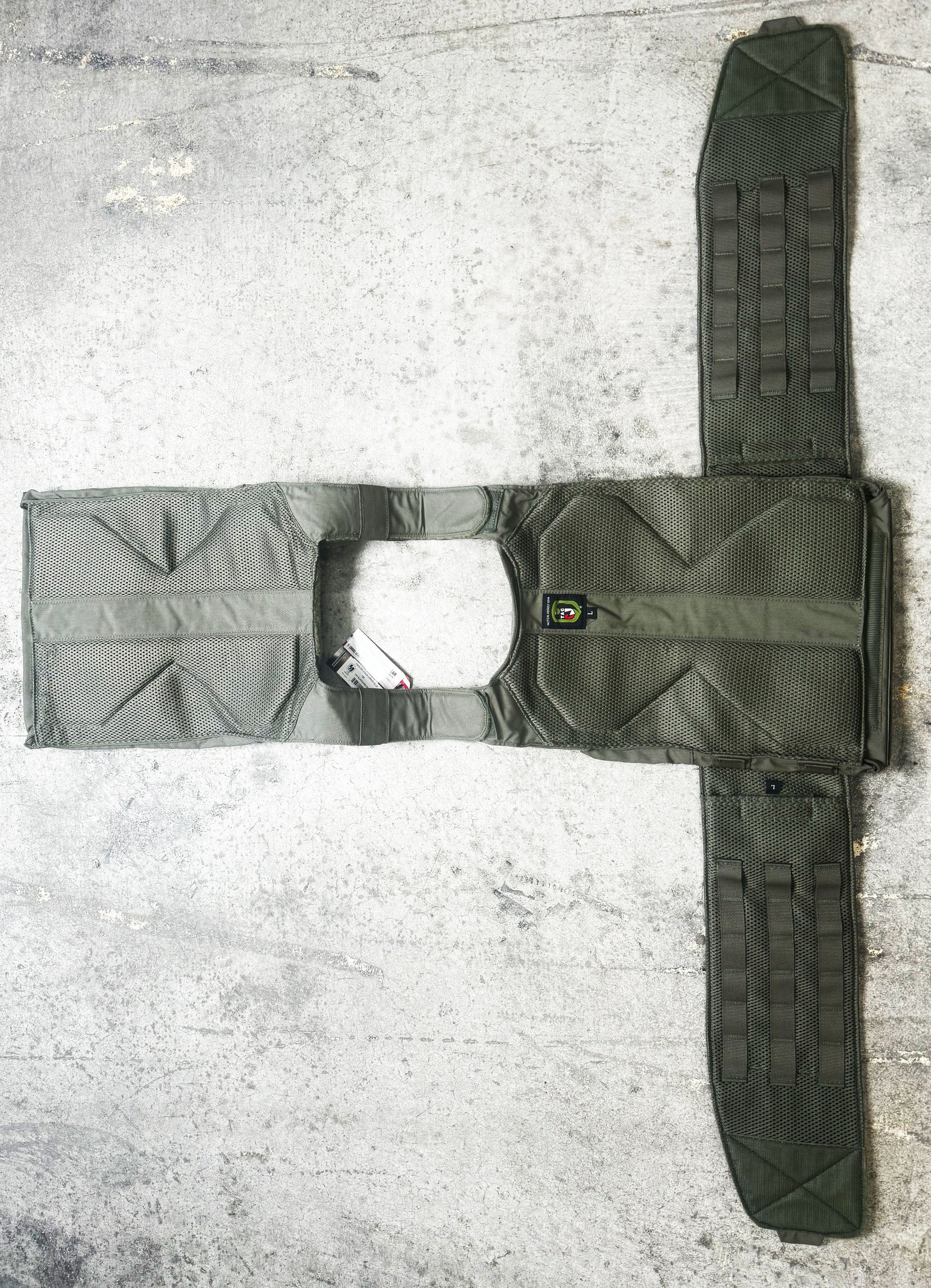 TAG’s® Vanguard plate carrier sets the standard in the industry for what a plate should be. The Vanguard is a light weight plate carrier that works with any set of hard armor plates and soft armor backers. SAPI, ESAPI, XSAPI, standalone level 4, swimmer cut and shooter cut armor plates all fit into the Vanguard. The triple magazine front panel is sewn into the carrier and will fit 30 round 5.56mm, AK47, and 7.62 x 51 magazines. You will never need to change out your magazine pouches again when using different weapon platforms.
