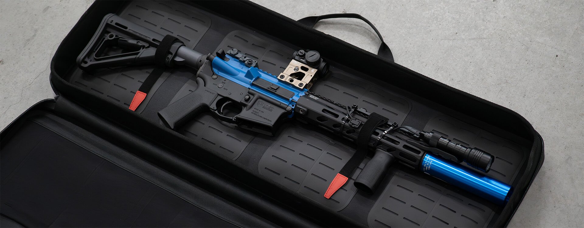 The Magpul DAKA Soft Case SC35 is a soft rifle case made from DAKA Grit material, making the case lightweight, flexible, durable, and weather resistant. The SC35 measures 35X3X12 and is designed to be used on those days when weight, speed, and flexibility matter the most. The cases two external YKK Aquaguard zippers are extremely rugged and include easy-grip 550 cord pulls that are reinforced with heat shrink-wrap for opening and closing the case. The case has a MOLLE-style base and includes four reconfigurable DAKA Gear Straps to secure a rifle, MOLLE-compatible pouches, or other gear. The interior of the lid features three stretchable mesh pockets to hold up to six PMAG LR/SRGEN M3 magazines, a mesh organizational pocket for small items, and a zippered pocket for smaller accessories and documents