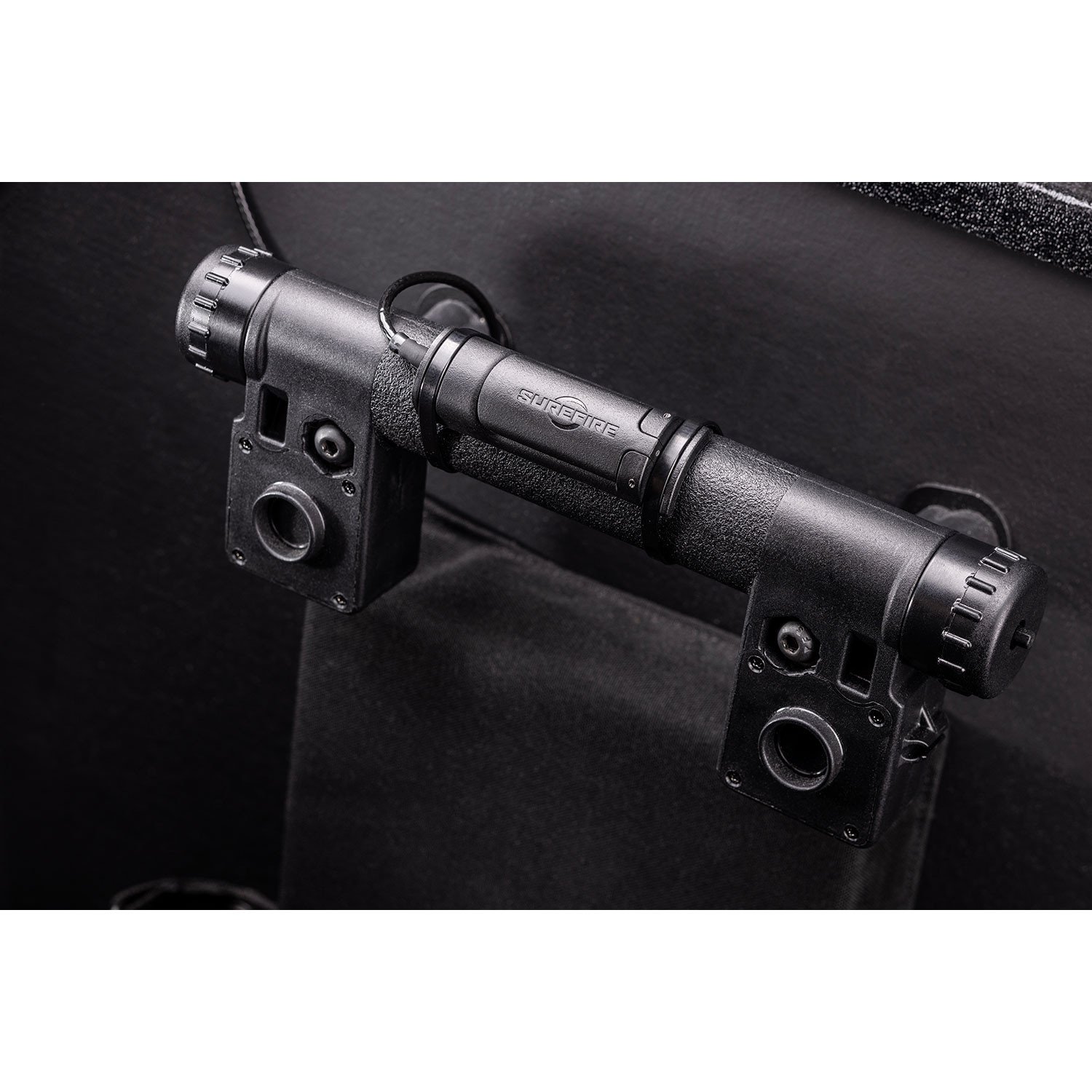 Maximize Your Shield's Utility. The SureFire BSL-A Ballistic Shield Light increases safety for military and law enforcement ballistic shield users. It installs easily on most ballistic shields, and its high-output LED generates 1,500 lumens of powerful illumination shaped by a precision Hybrid beam reflector optimized for medium- to long-range visibility and situational awareness. The BSL-A disrupts the night-adapted vision of potential aggressors and allows for strategic peeking around corners without backlighting the user. Its Dual Fuel design affords you the versatility of using the included rechargeable 18650 lithium-ion battery or two 123 lithium batteries for power. Our intuitive switching incorporates a pressure switch for momentary-on control and a click-through constant-on switch for unmanned shield placement. Precision-machined of aerospace-grade aluminum, O-ring sealed, and Mil-Spec hard-anodized for durability, the BLS-A's rugged body can withstand tremendous punishment, including submersion in up to 1 meter of water for 30 minutes. Every BLS-A also includes a rubber cover and protective lens for training rounds. It is built to perform no matter how demanding the mission.