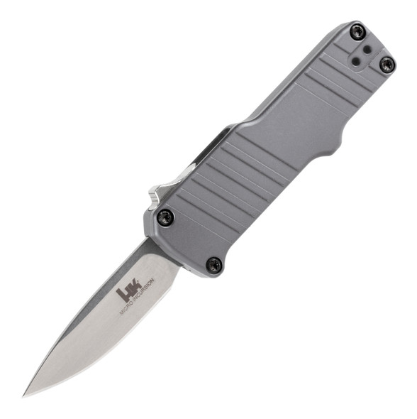 Heckler & Koch Knives are specially designed and built for the professional knife user. Whether you're military, law enforcement, rescue, first responder, or simply in need of an everyday carry, you have to have a cutting tool you can rely on every time. Each knife that leaves the floor leverages the know-how of three generations of passionate craftsmen who are also end-users.


The HK Micro Incursion OTF Auto employs a switch operated blade which instantly deploys and retracts out-the-front for total control. Its ultra-compact and versatile design allows easy storage and quick response when needed. It features a sub-two-inch cryogenically heat treated 154CM stainless steel blade with heavy-duty 6061-T6 machined aluminum handles. 154CM is a hard-working, highly stain-resistant steel that takes and holds a keen edge. The Micro Incursion is designed and built for speed and reliability every time and includes a carbide glass breaker and deep carry bayonet-style pocket clip.