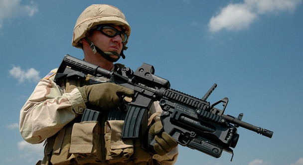 The HK GLM (Grenade Launcher Module) is a 40x46mm system that can be used with either lethal or less-lethal munitions for Military or Law Enforcement use.
The HK GLM is a light weight stand-alone or host weapon mounted 40x46mm single shot grenade launcher that is side breach opening/ loading, utilizing a double-action trigger with ambidextrous safety and controls. The system incorporates a collapsing/extendable and removable stock as well as other accessories.
It is capable of fifiring multiple use munitions/projectiles to include High Explosive “HE” rounds to an effective range of 350M, illumination rounds for signaling and visibility, Smoke for screening and obscuring, CS, and various less lethal munitions for crowd and riot control at closer ranges.
The GLM can be used in a Stand-Alone Mode (SAM) or it can be host mounted to another riflfle system via optional mounting solutions. The common mounting solutions are for the HK416, HK417, M16A2,
and M4.
Background:
In the 1970s Heckler & Koch “HK” developed and produced the 40x46mm Steel stand-alone HK69 grenade launcher which was similar in performance to the US Military M79 grenade launcher at the time.
HK made updates to our existing grenade launchers through internal product improvement efforts which became the HK Grenade Launcher Module (GLM) 40x46mm based on our previous HK 40x46mm systems. The HK GLM was offered to the US Army in 2005 and tested with limited production in 2006 as the XM320. After successful testing the system was approved and type-classifified and procured as the M320/M320A1 (for use on the M16A2 or M4 as well as a stand-alone system) by the US Army in 2008. HK has provided over 40,000 HK GLM type systems to the USA for Military or Law Enforcement use.
HK weapon systems are manufactured with an ISO-9001 quality and test process. HK weapons are additionally tested to the NATO AC/225 requirements.