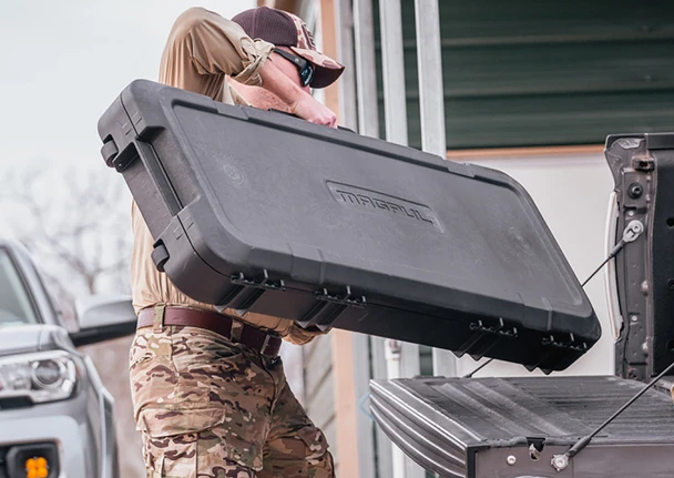 Magpul DAKA Hard Cases were designed to fix the many shortcomings of current hard case offerings, providing a stronger, easier-to-use, and more reliable transportation and storage system. Combined with the transformative features of the DAKA GRID Organizer, our DAKA Hard Cases represent a quantum leap in capabilities and features. Streamlined with minimal potential snagging points, easy to maneuver, and full of usable protective space, they include advanced features such as better latches, recessed lock housings, ergonomic handles, and dependable wheels, all in a package that provides greater protection for your important gear. Built around the uniquely customizable DAKA GRID Organizer, each of the three DAKA Hard Cases is designed with specific rifle and gear needs in mind. The C35 accommodates shorter carbines comfortably, along with much of the additional support gear and accessories youll need to travel with them. The GRID is made of individual Expanded Polypropylene (EPP) end Panels, center Panels, and DAKA Blocks that nest securely together to create an advanced internal system that organizes and protects everything in your case. The DAKA Blocks are easily pressed into the GRID Panels and are just as easily removed and reinstalled to fit the specific needs of what youre carrying each time you pack up your case. As opposed to traditional foam inserts, the GRID doesnt trap moisture, dirt, or other contaminants, and GRID wipes clean with a damp cloth. Its lighter and endlessly customizable, allowing you to maximize more space inside your case. Its also stronger and holds your gear in place better than traditional foam, providing better protection all around. Changing the arrangement of the GRID to meet your loadouts needs is easy, fast, and youll never have to deal with the many issues that come with open cell foam. Complementing the strengths and features of the GRID, the Hard Cases injection molding technology using gas charged polypropylene reduces weight, provides greater strength, and enhances case integrity compared to other conventional cases. The result is greater durability and drop performance that stands up to the toughest shipping, travel, and hard-use environments. Weve also added extra storage space with its four double-walled corner pockets, creating bumper zones for added impact resistance that double as extra storage for other smaller items. The latch design, along with the greater case rigidity, makes the latches simple to use and incredibly rugged. Each latch features a large, easily operated push-button release that can be activated with one hand. When pressed, the latch opens and remains in the open position, and it can be used as a handle to open the lid. The latch closes with simple downward pressure anywhere on the latch body, and theres a clear audible click when its secured. The innovative latch design also features a reimagined latch lockout system. Each latch contains one lock pass-through and, once a lock is installed (a 5/16 shackle lock is recommended), the latch cannot be opened until the lock is removed. Additionally, each latch features a lock housing and a zip tie pass-through that allows the user to secure the lock to a recess in the latch, protecting the lock and the case from damage due to impacts or from having the lock snag on something. Including the latch and lock attachment points together mitigates the risk of your case opening or having the lock snag and rip free. Nesting lugs on the Hard Case provide a positive interface when multiple Hard Cases are stacked on each other, and two built-in strap recesses keep ratchet straps in place and secured during use. There are two, large main handles that are easy to manipulate under load, and a third, integrated handle near the wheels makes the case easier to move and allows it to stand vertically on its own. The handles have cross sections that are modeled on Magpul pistol grips for greater comfort and control, and they recess completely into the cases frame. Theyre designed to stay open once theyre extended and stay closed when stowed. The wheels are designed for smooth rolling and longevity, with reduced noise, friction, and debris incursion thanks to the ball bearings, rubber overmolding, and reinforced polymer hubs. This LR53 Case has interior measurements of 53.8 x 16.6 x 5.5" and will accept most shotguns and long rifles.Made in the USA.