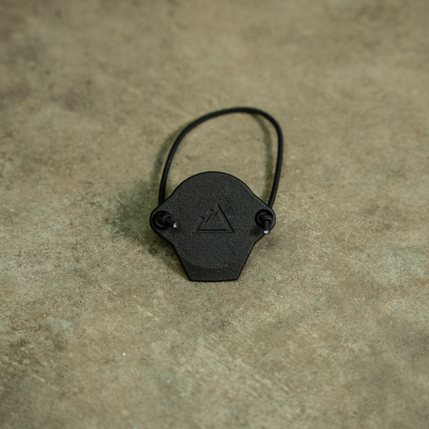 The LightCap is designed with an integral lever that allows the shooter to flip the LightCap off the bezel of the light for rapid deployment of the white light. The included ranger band allows the LightCap to be retained near the bezel when removed so that it can be quickly placed back over the bezel.

