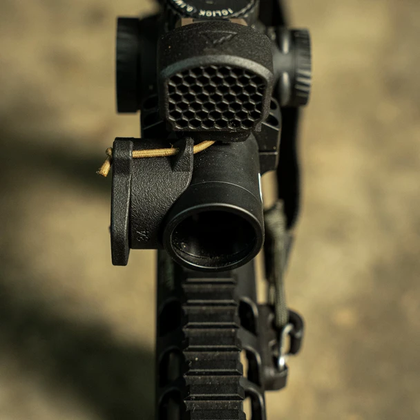 The Cap itself is a simple, rugged, and low-profile solution to protect your scope's lenses and eliminate any reflections from them when not in use. Our signature flipper tab is integral to the ScopeCap and allows for fast and easy removal from your scope's bezel. When doffed, they have a lower profile than traditional flip style scope caps.

