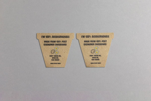 Two biodegradable seed paper flower pot labels made from 100% post-consumer cardboard, featuring a natural brown colour.