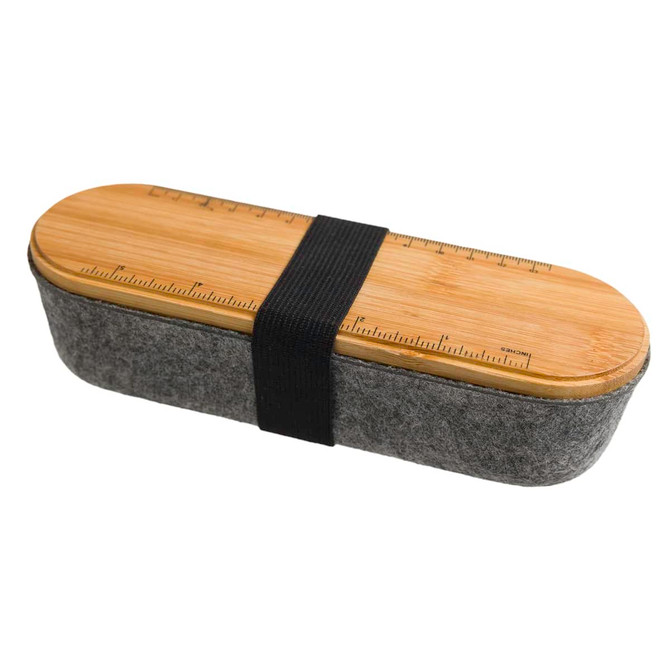 A gray utility case with a wooden lid featuring a ruler design, secured by a black strap.