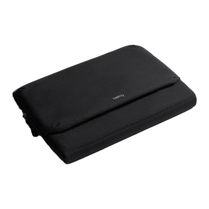 A sleek black laptop caddy with a simple design and a logo. It features a zip closure and a padded exterior.