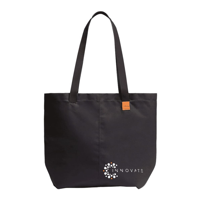 A black tote bag with long handles, featuring a logo at the bottom.