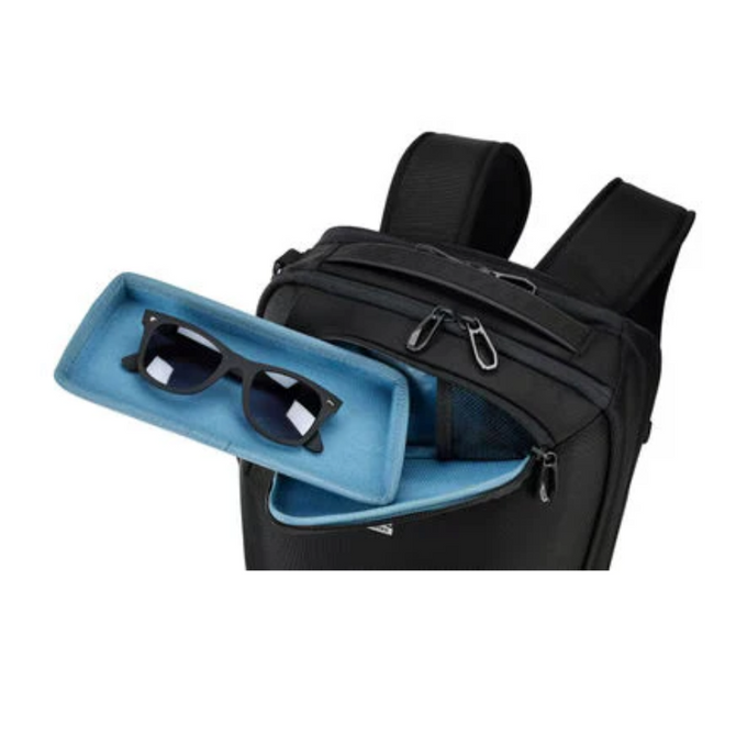 Black backpack with sunglasses in blue storage compartment.