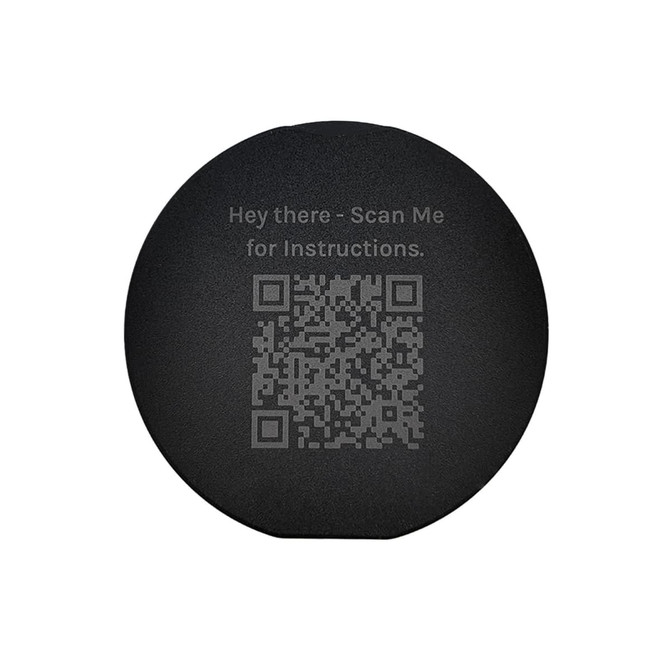 A circular black phone grip featuring a QR code and text for instructions.