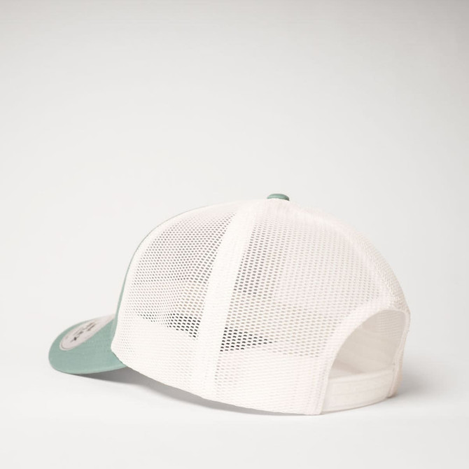 A green and white UFlex Classic Ultra-lite 6 Panel Trucker Cap featuring a mesh back and a logo.
