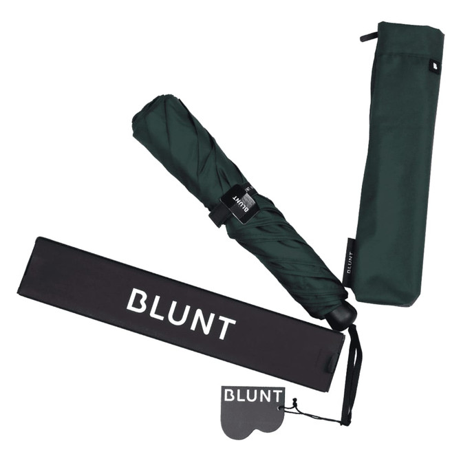 A dark green BLUNT Metro Umbrella with a matching sleeve and a storage pouch, featuring a logo.
