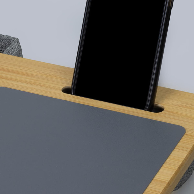 A bamboo lap desk featuring a grey surface and a slot for holding a smartphone.