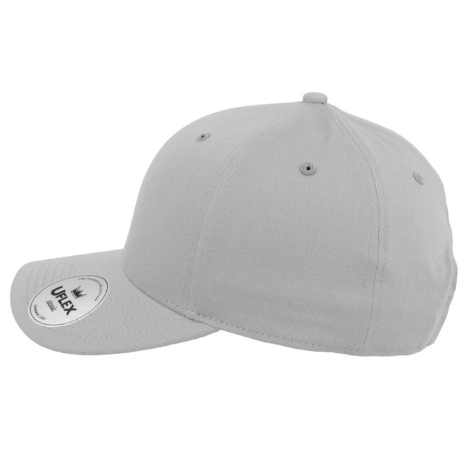 A grey five-panel cap featuring ventilation holes and a branded label on the side.