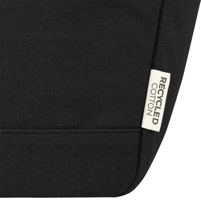A black cooler tote featuring a recycled cotton label and a simple, sleek design.