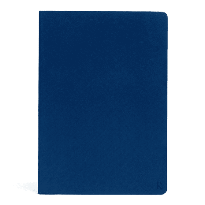 A navy A5 softcover notebook with a smooth finish and a subtle logo on the bottom corner.