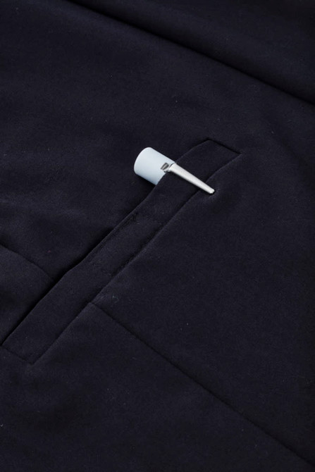 A navy women's comfort waist cargo skirt featuring a side pocket and a hanging tag.