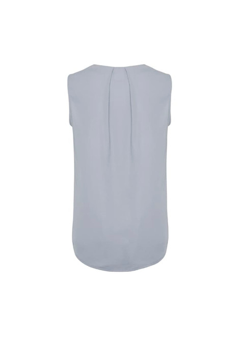 A pale blue sleeveless blouse with pleat detail at the back and a rounded hemline. It has a branding logo.