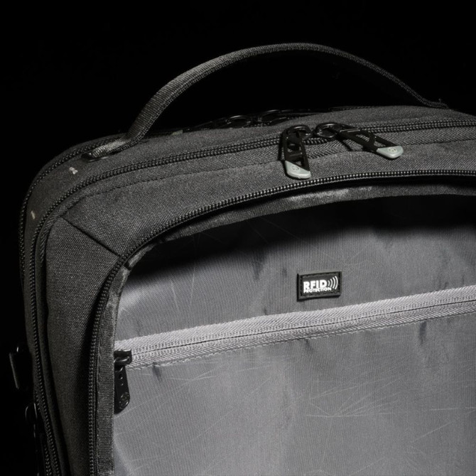 Black RFID-protected travel bag with secure zipper and handle.