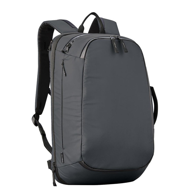 Sleek gray Stormtech backpack with padded straps and multiple compartments for travel and work.