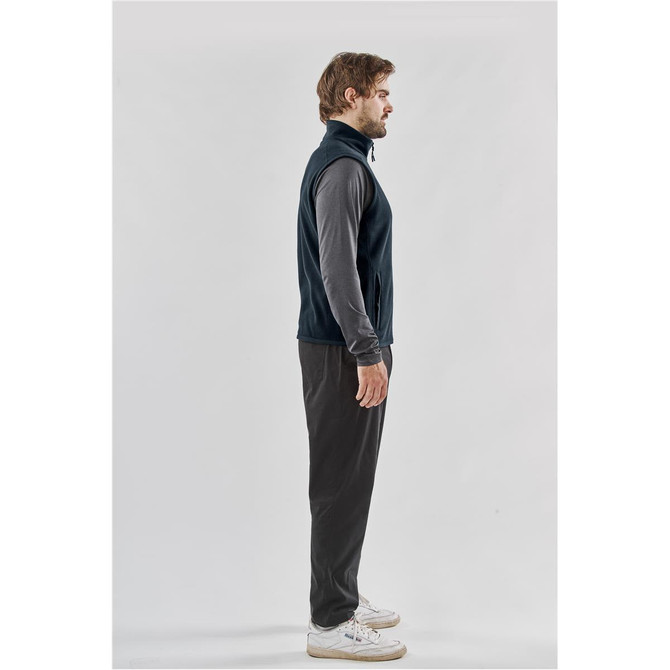 A navy fleece vest displayed on a male model, featuring a zip closure and side pockets.