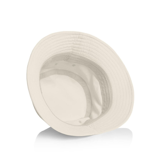 A cream Nylon Bucket Hat featuring a wide brim, with an interior lining and a small logo inside.