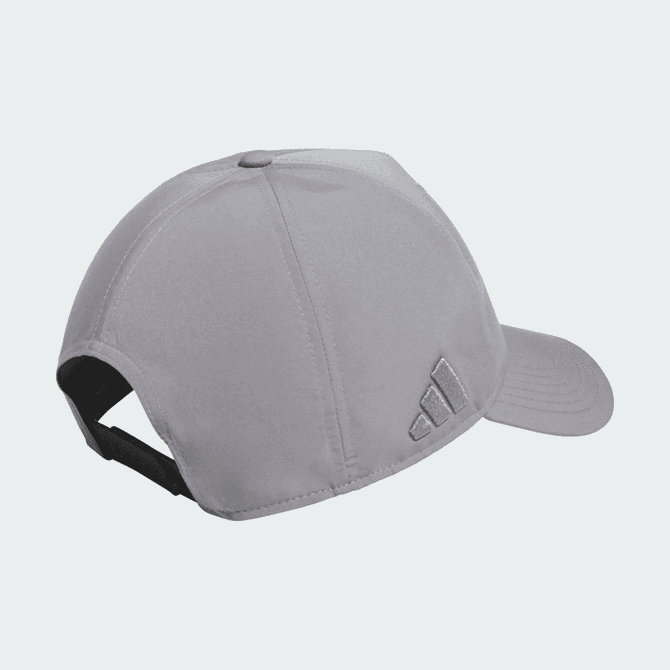 A grey Adidas performance golf cap with a curved brim and an adjustable strap at the back, featuring a logo.