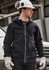 A black unisex zip front hoodie with multiple pockets, worn by a man in a hard hat and gloves, standing near a vehicle.