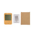 A weather station with a bamboo frame, a user manual, and a cardboard box.