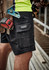 Black men's cargo shorts with multiple pockets, featuring a logo, ideal for work environments.