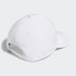 A white six-panel cap with a curved brim, featuring a logo on the side and an adjustable strap at the back.