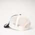 A navy and off-white UFlex Classic Ultra-lite 6 Panel Trucker Cap featuring a mesh back and a logo.