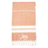 A 100% cotton Turkish towel in a warm orange hue with white stripes and frayed edges, featuring a logo.