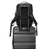 Backpack attached to luggage handle, convenient travel setup.