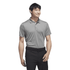 A grey recycled performance polo shirt, featuring a logo, worn by a smiling man against a white background.