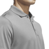 A grey polo shirt with a collar, featuring a logo, displayed on a mannequin's upper body.