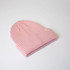 A pink ribbed beanie with a folded brim and a small logo on the side.