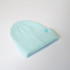 A light blue Fisherman's Beanie with a ribbed texture and a small logo on the side.