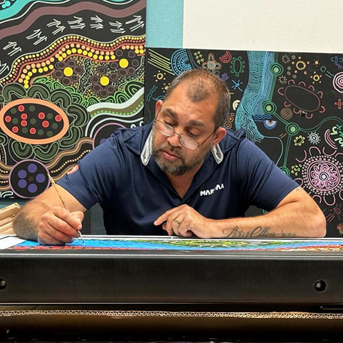Kevin Bynder working on artwork in the office