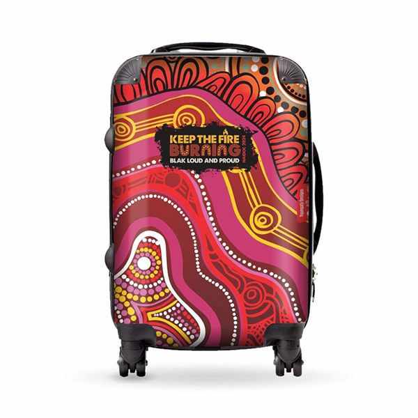 A vibrant suitcase with Aboriginal-inspired art, featuring swirling patterns in red, pink, and orange