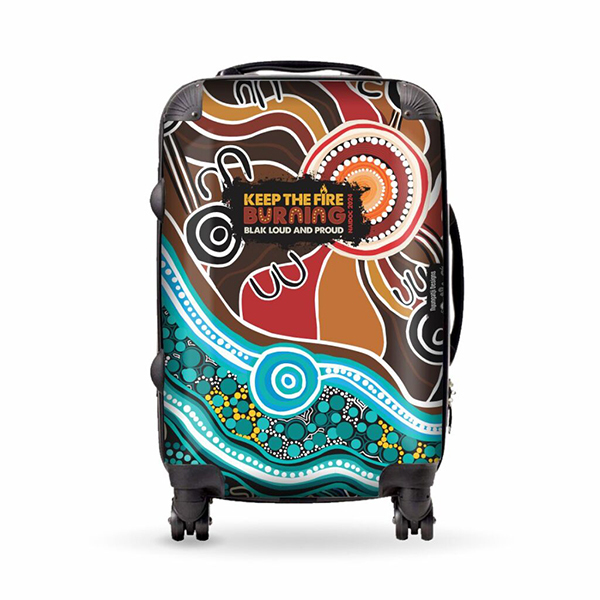 A vibrant suitcase with Indigenous Australian art in earthy tones and turquoise