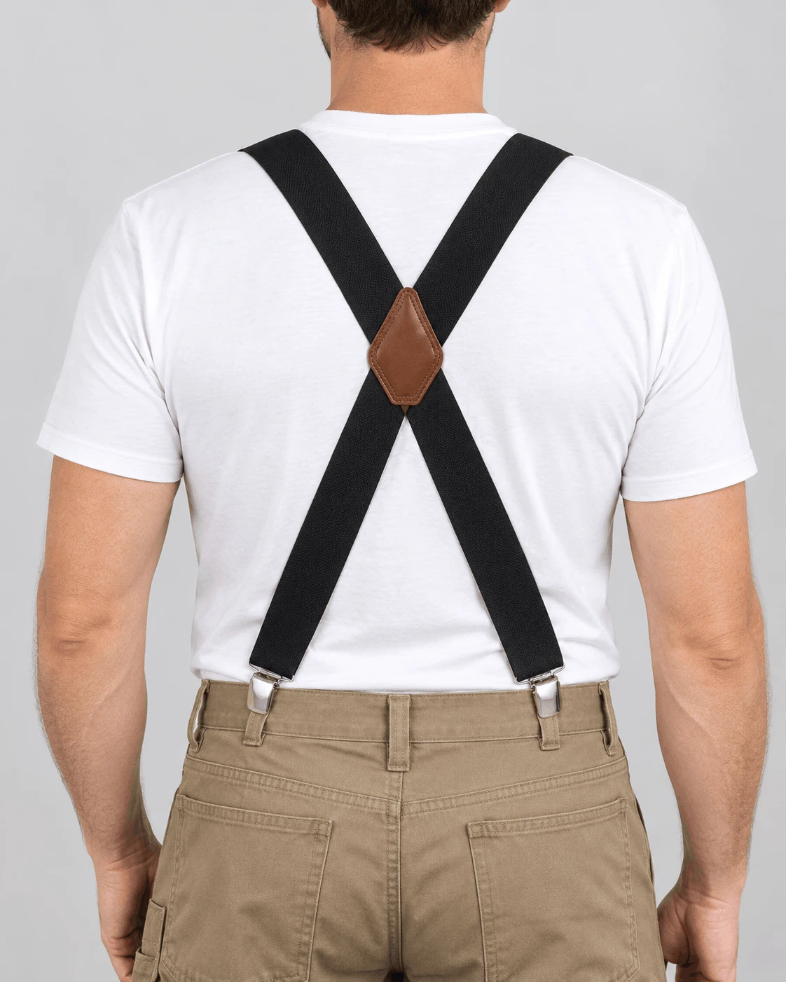 Back view of 2 inch wide black elastic X-back suspenders crossing at a leather patch for even all-day support