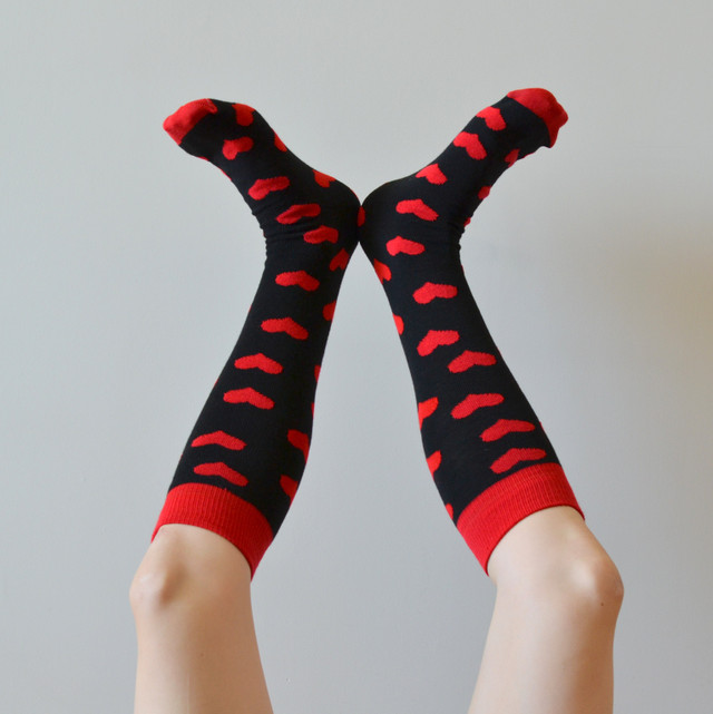 pair of red and black heart socks upside down