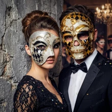 Gold and black harlequin skull mask paired with a silver Venetian half mask with baroque details.