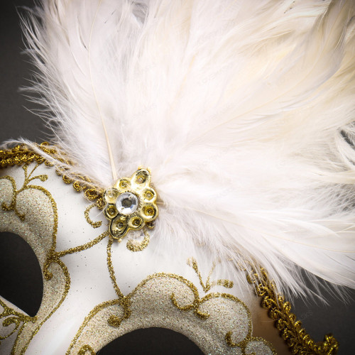 Elegant gold and white mask with feathers and crown on Craiyon