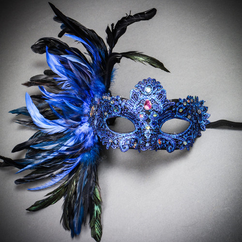 A woman in a feather Venetian mask poses during the Venice