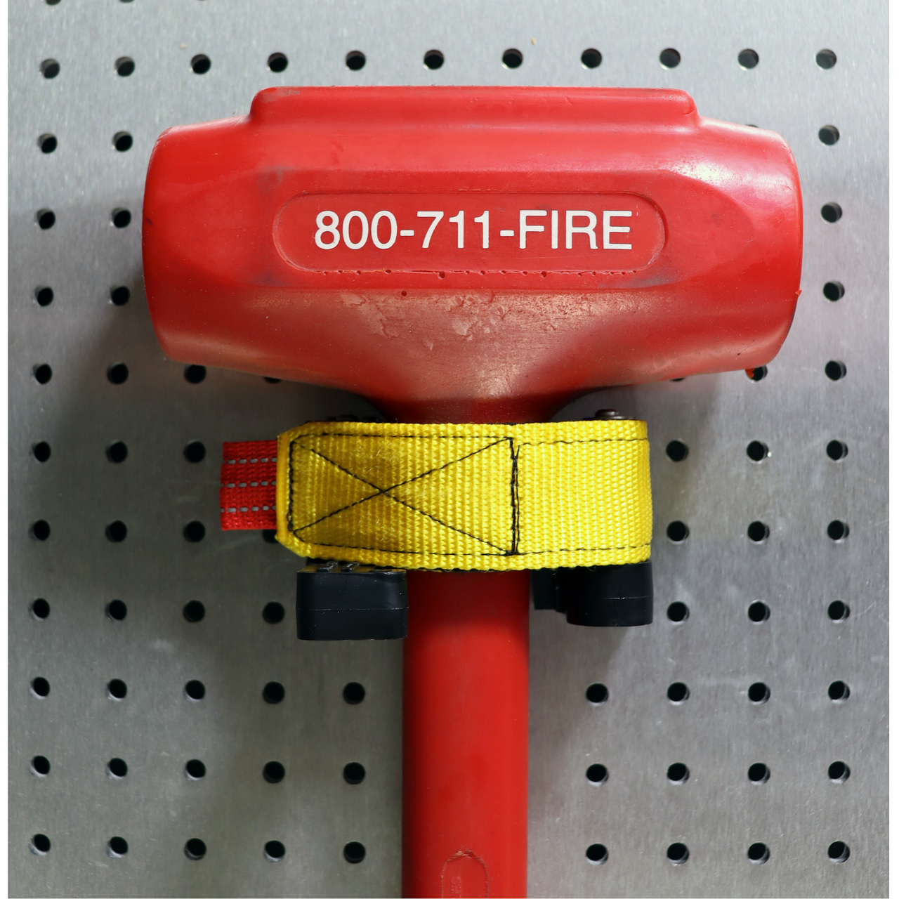 Zico SURE-GRIP mount holding hand tool on emergency vehicle fire service